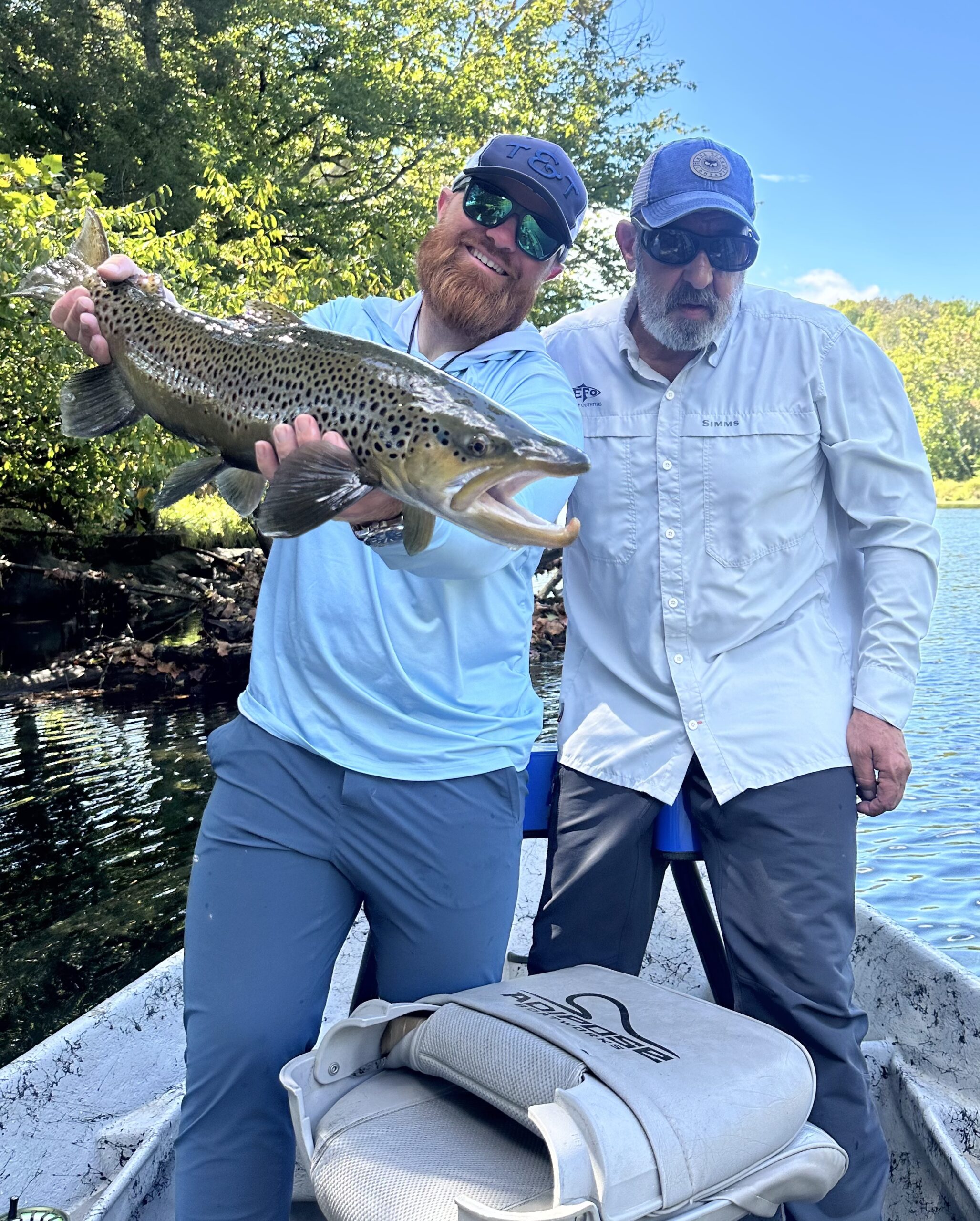Sam Presutti guiding fly fishing trips with large brown trout