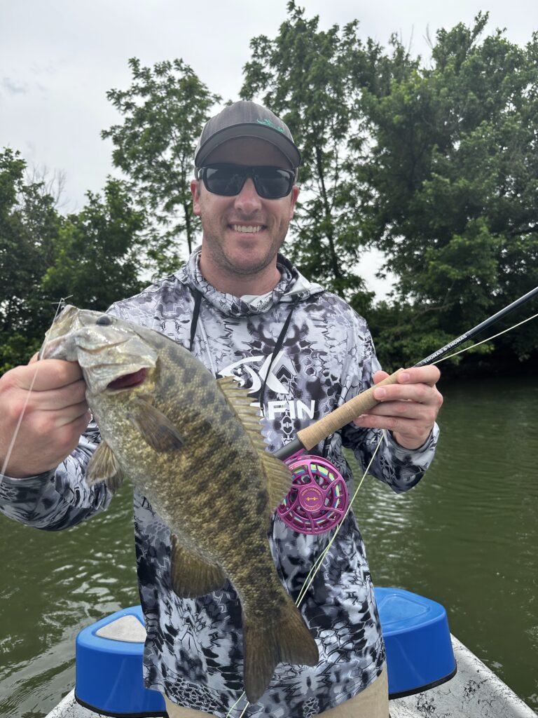 “Aaron with a stellar smallmouth caught on a popper on the Holston River”