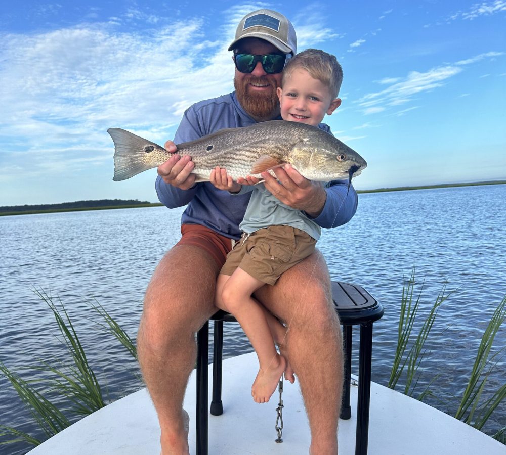 Sam Presutti and son Holston with large redfish
